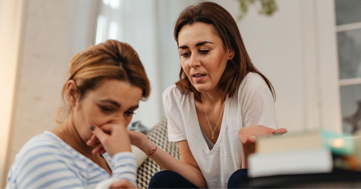 Therapist comforting sad client