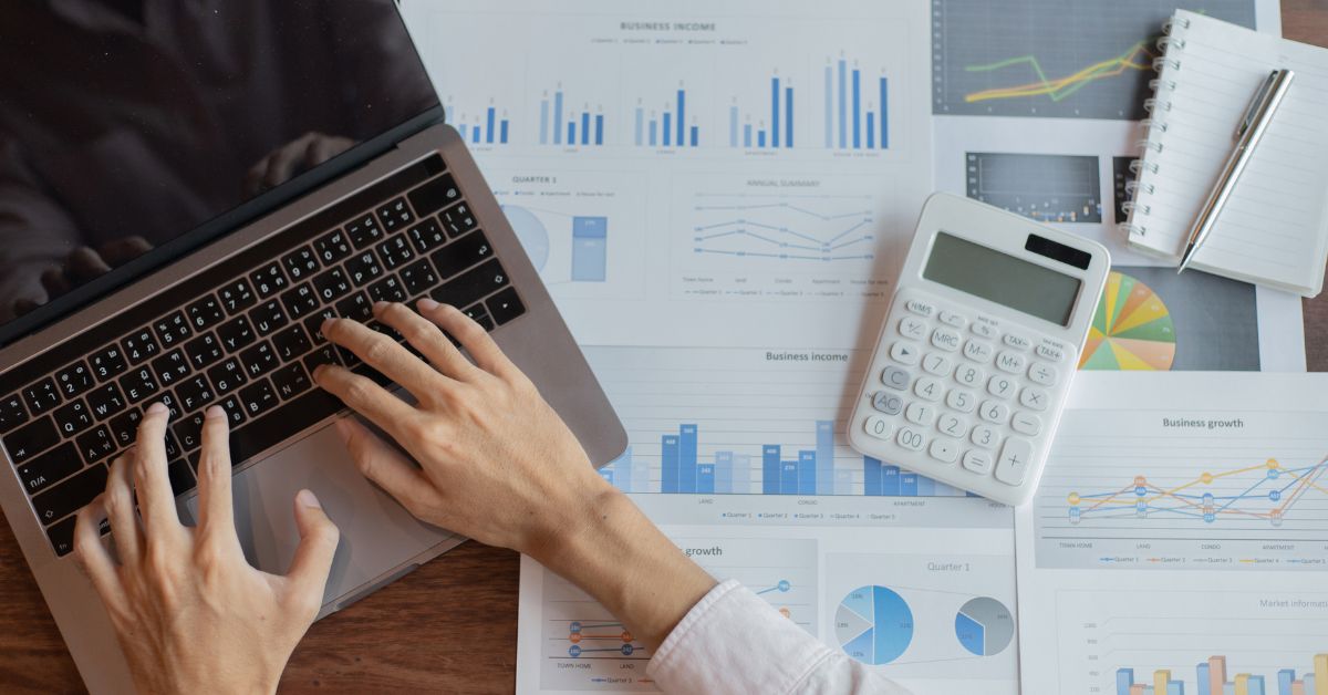 Person working on finances on laptop