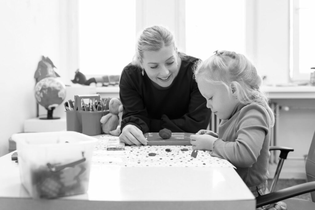 woman smiling at girl